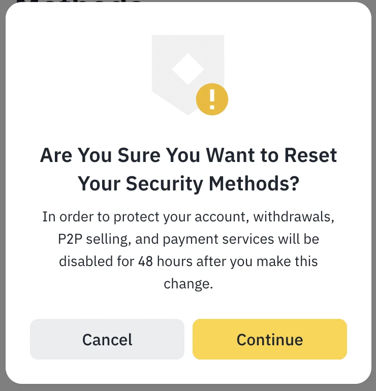 Binance-ன் "Are You Sure You Want to Reset Your Security Methods?" pop-up; withdrawals, P2P selling மற்றும் payment services 48 மணி நேரத்திற்கு முடக்கப்படும் என்று எழுதப்பட்டுள்ளது, Cancel மற்றும் Continue பொத்தான்கள் தெரிகின்றன