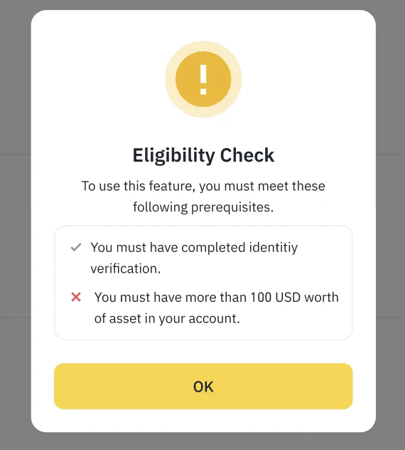 Binance-ன் Eligibility Check pop-up; identity verification முடிந்திருக்க வேண்டும் என்ற வரிக்கு அருகில் tick குறியும், account-ல் 100 USD-க்கு மேல் சொத்து இருக்க வேண்டும் என்ற வரிக்கு அருகில் சிவப்பு X குறியும் காட்டப்பட்டுள்ளன